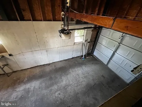 a view of room with wooden floor
