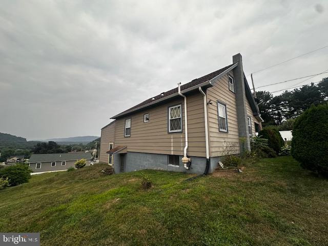 303 16th Street Saxton, PA 16678 - Photo 10 of 44 a view of a house with a backyard