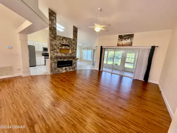 a view of a livingroom with furniture and wooden floor