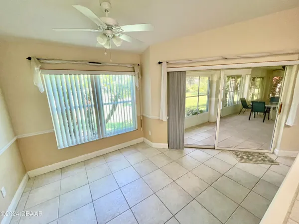 a view of an empty room with glass door