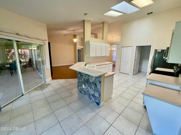 a kitchen with stainless steel appliances granite countertop a sink and a stove