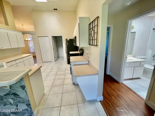 a view of a kitchen from the dinning room