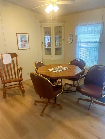 a dining room with furniture and window