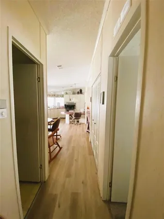 a view of a living room with a wooden floor