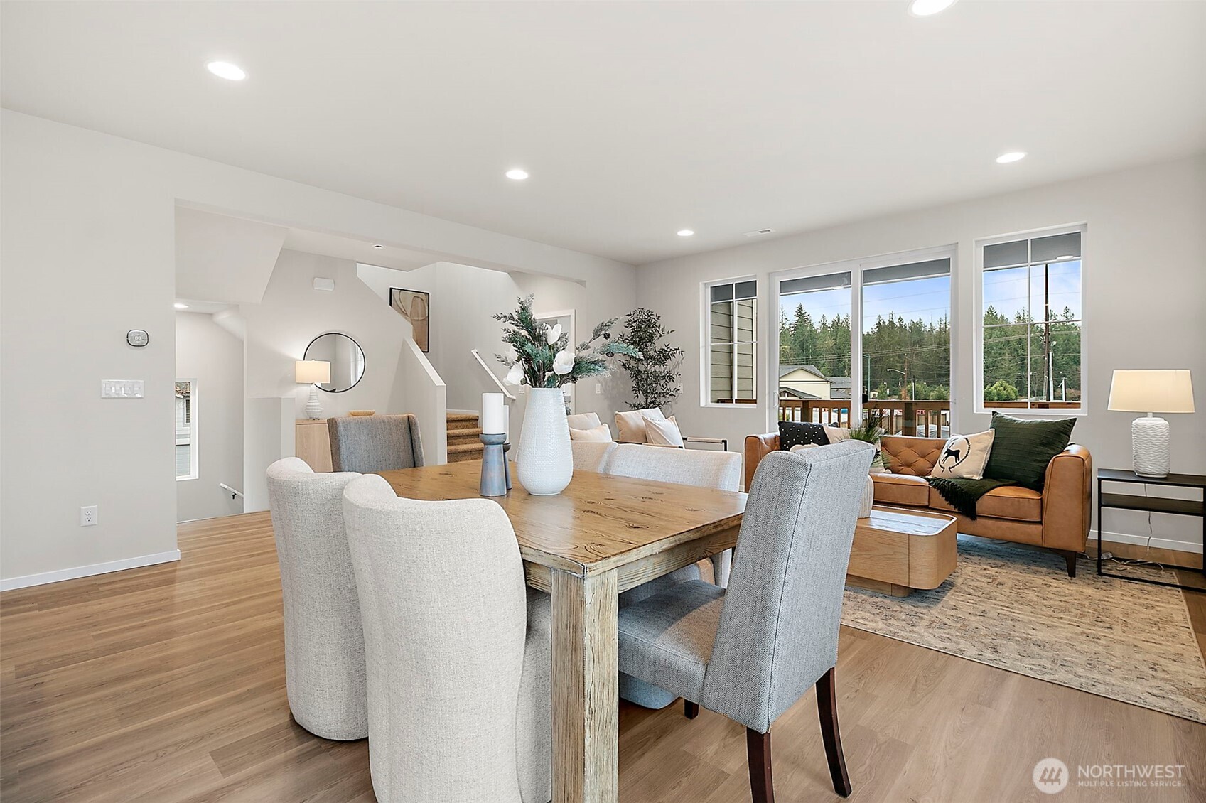 18510 Southeast 271st Place Covington, WA 98042 - Photo 12 of 23 a view of a dining room with furniture window and wooden floor