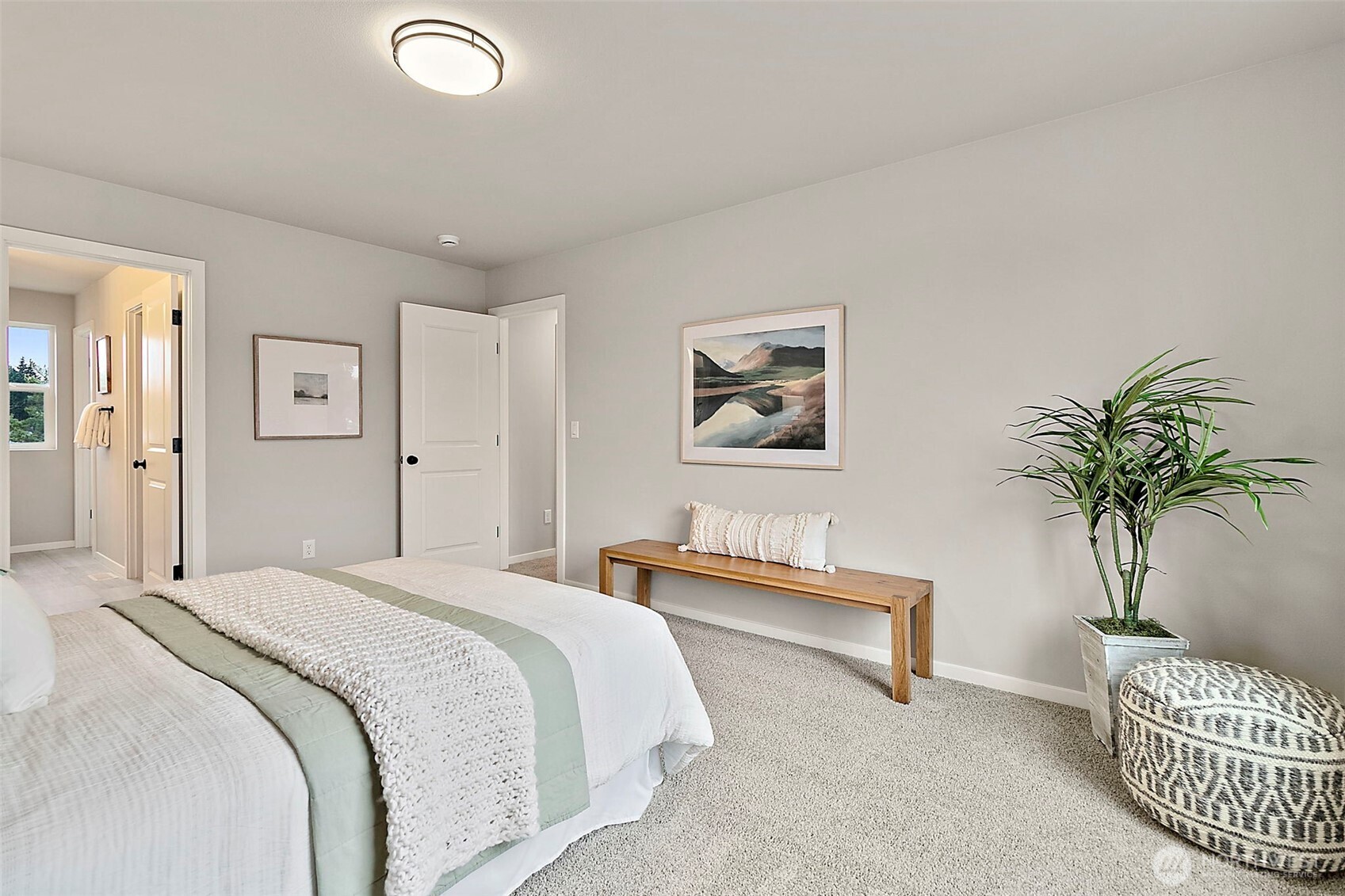 18510 Southeast 271st Place Covington, WA 98042 - Photo 16 of 23 a bedroom with a bed and a potted plant