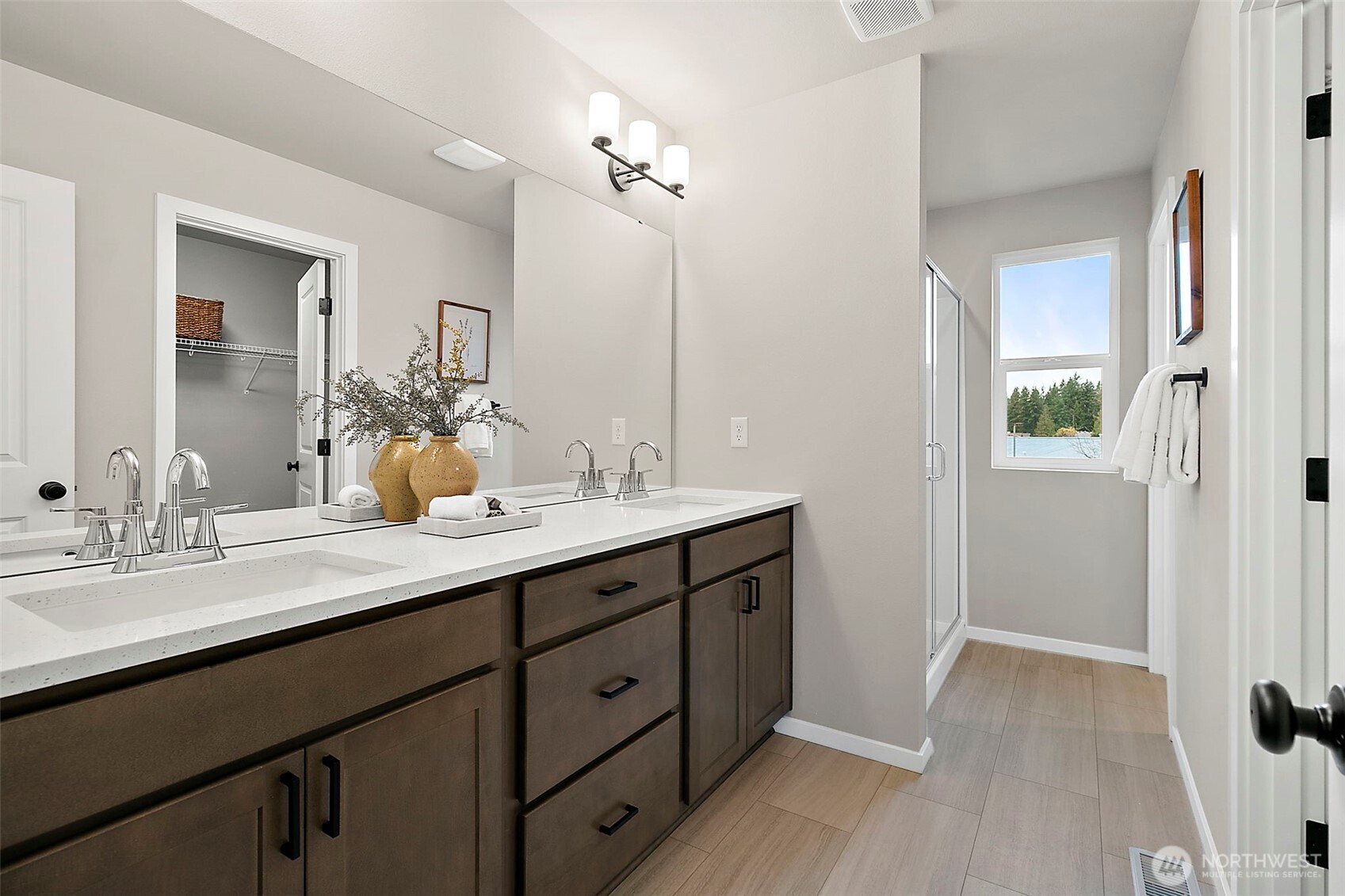 18510 Southeast 271st Place Covington, WA 98042 - Photo 17 of 23 a bathroom with a double vanity sink and a mirror