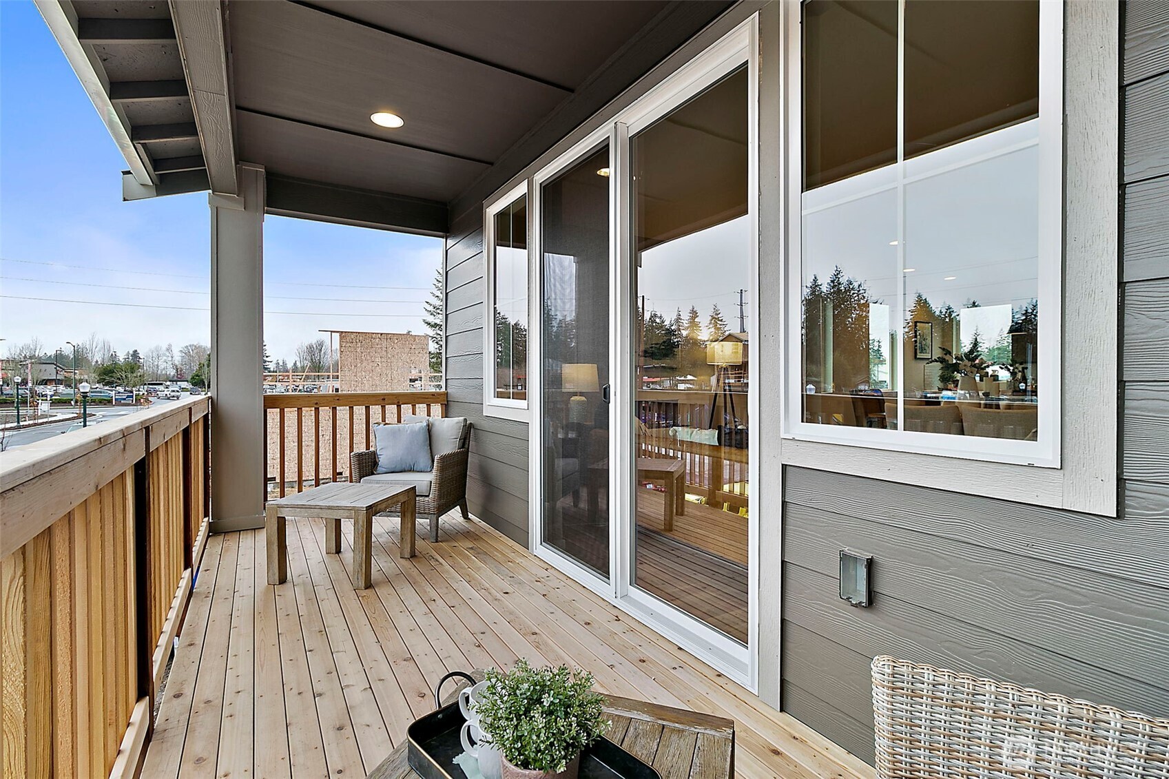 18510 Southeast 271st Place Covington, WA 98042 - Photo 22 of 23 a balcony with wooden floor and outdoor seating