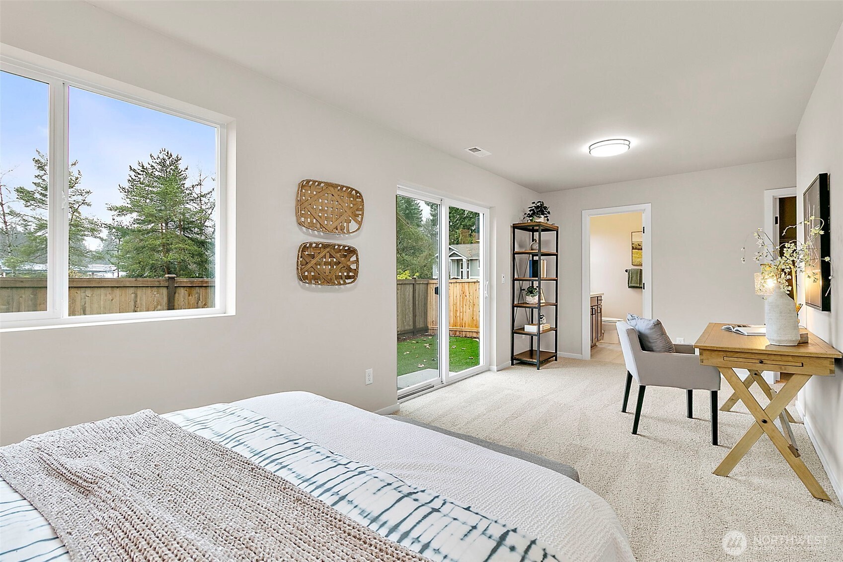 18510 Southeast 271st Place Covington, WA 98042 - Photo 5 of 23 a bedroom with a bed and a table with chair