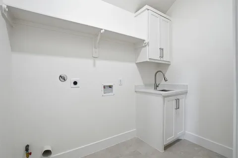 a bathroom with a sink and cabinets