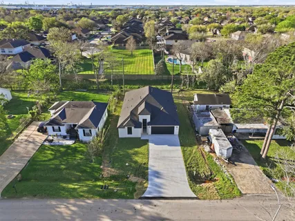 an aerial view of a house with a garden