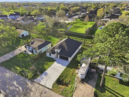 an aerial view of a house with a garden