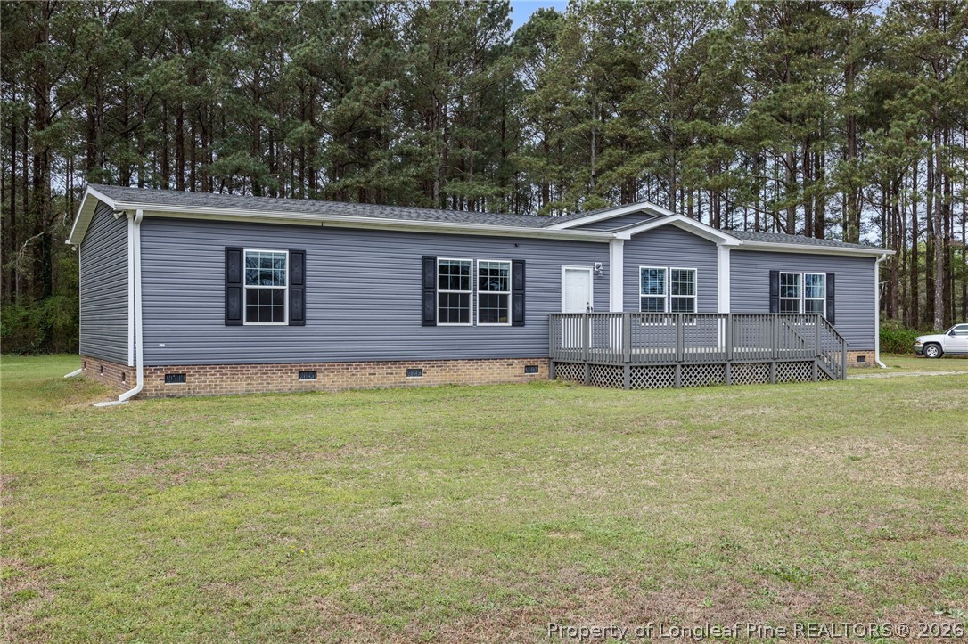 2252 Old Stage Road South Erwin, NC 28339 - Photo 3 of 47 a front view of a house with garden
