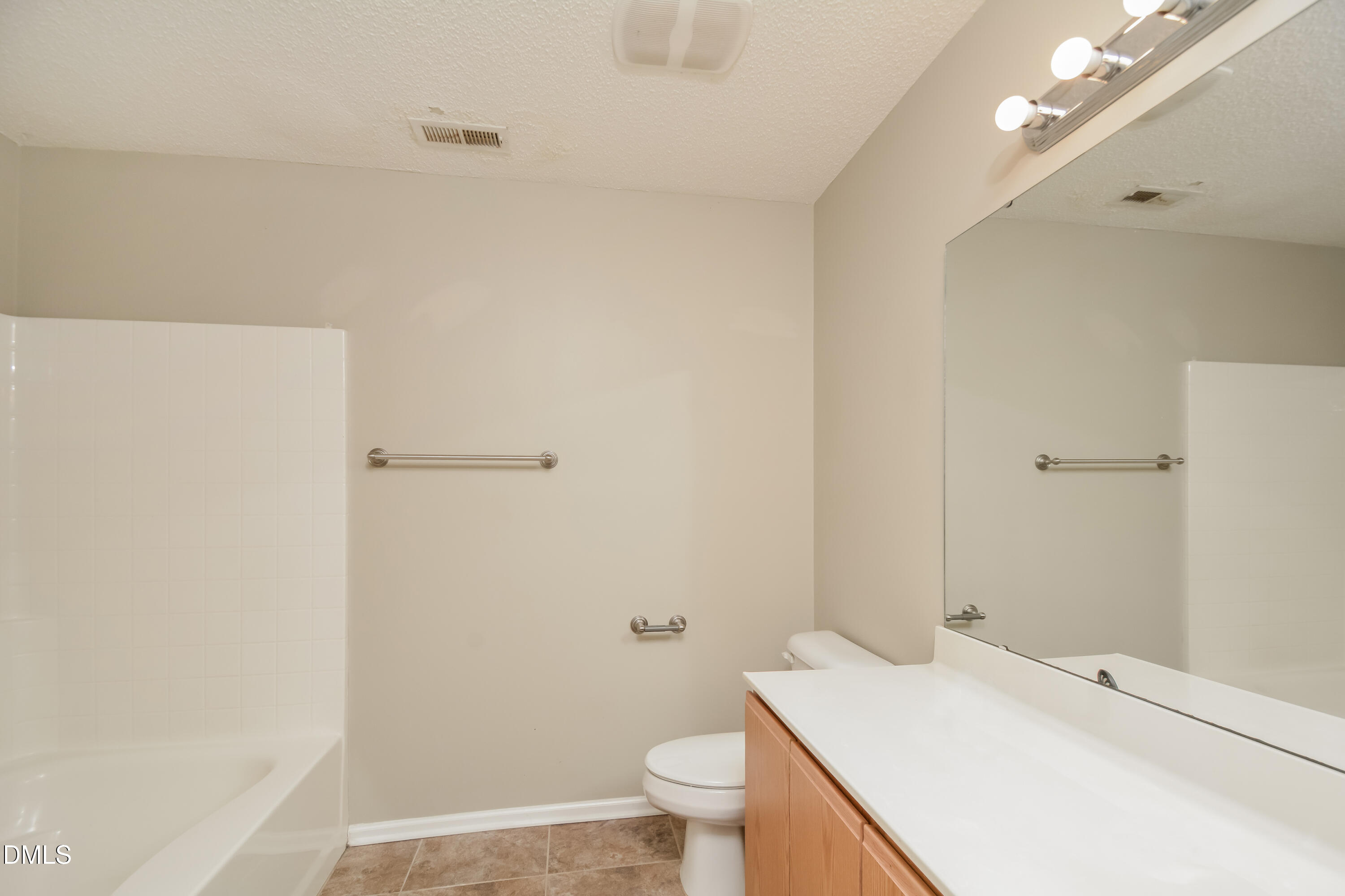 808 Woodside Park Lane Durham, NC 27704 - Photo 8 of 17 a bathroom with a sink a toilet and shower
