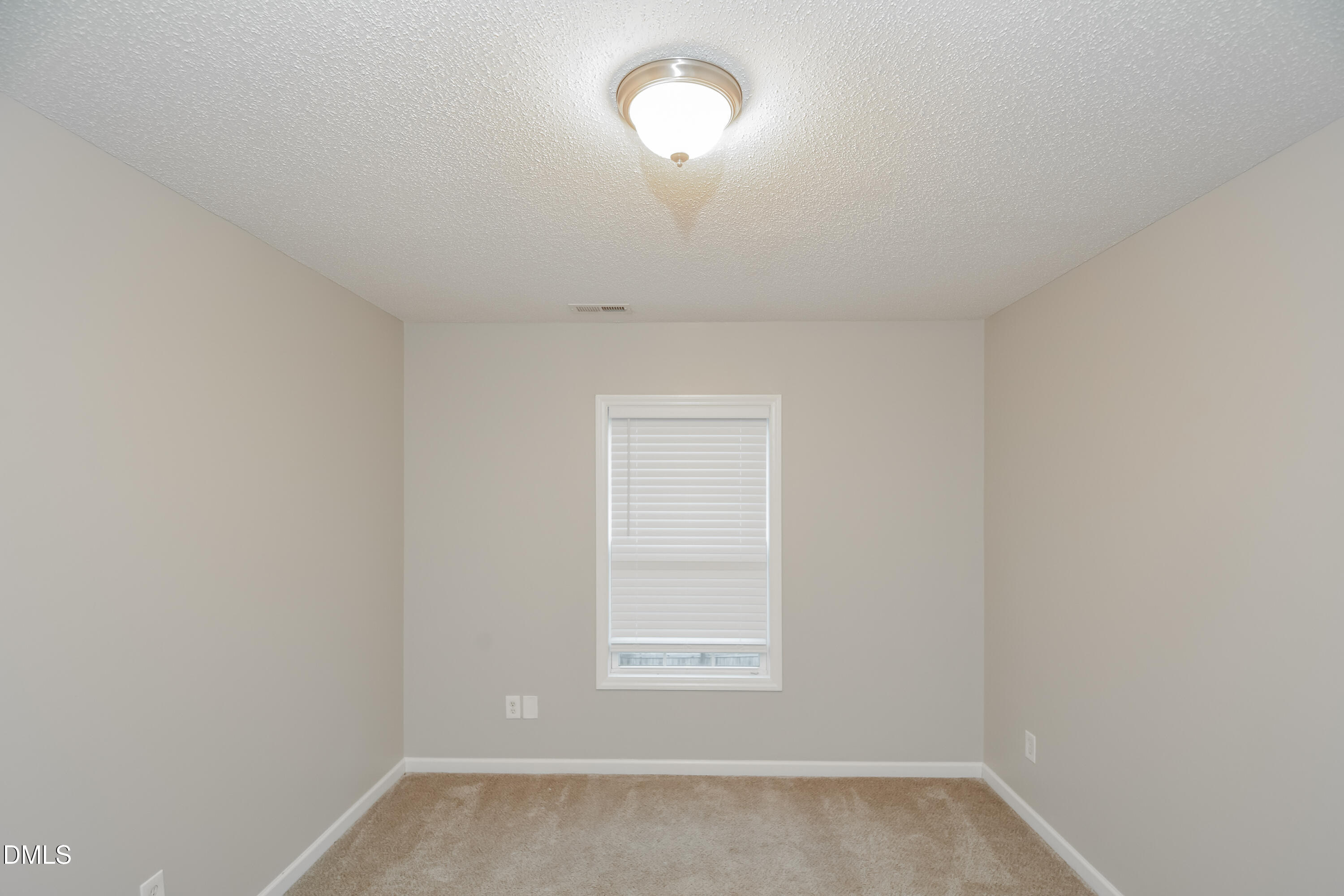 808 Woodside Park Lane Durham, NC 27704 - Photo 10 of 17 an empty room with a window
