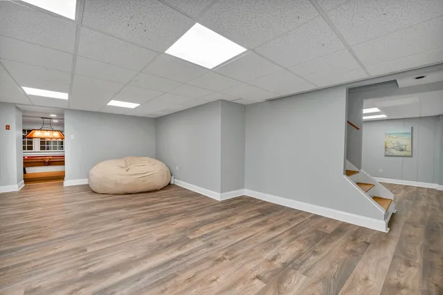 a view of an empty room and wooden floor