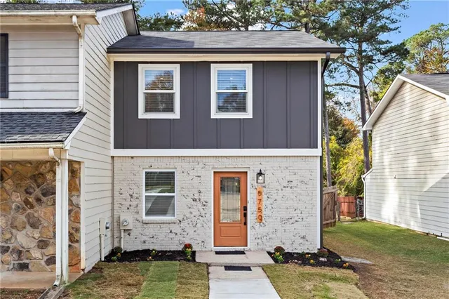 a front view of a house with brick walls
