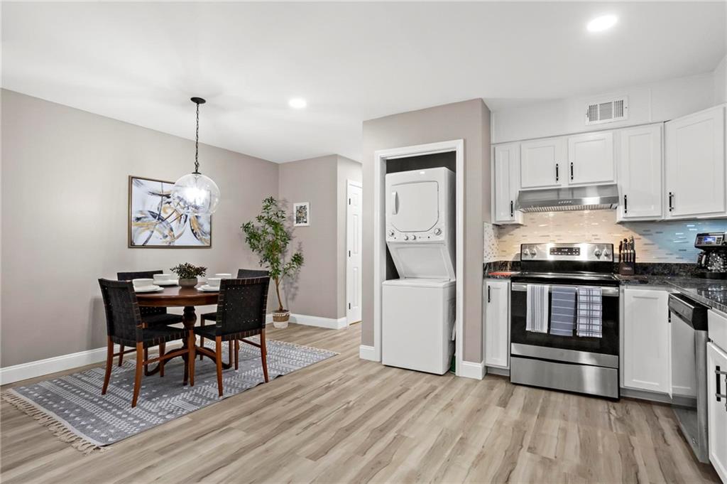 5750 Old Gordon Road Mableton, GA 30126 - Photo 15 of 31 a view of a dining room with furniture window and wooden floor