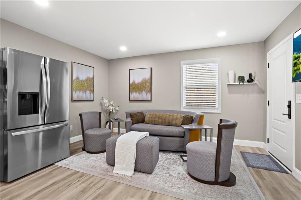 5750 Old Gordon Road Mableton, GA 30126 - Photo 17 of 31 a living room with furniture windows and a flat screen tv