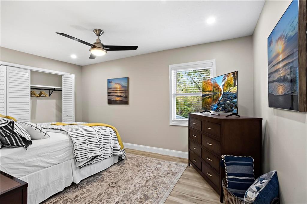 5750 Old Gordon Road Mableton, GA 30126 - Photo 20 of 31 a bedroom with a bed and wooden floor