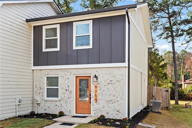 a front view of a house with a garage