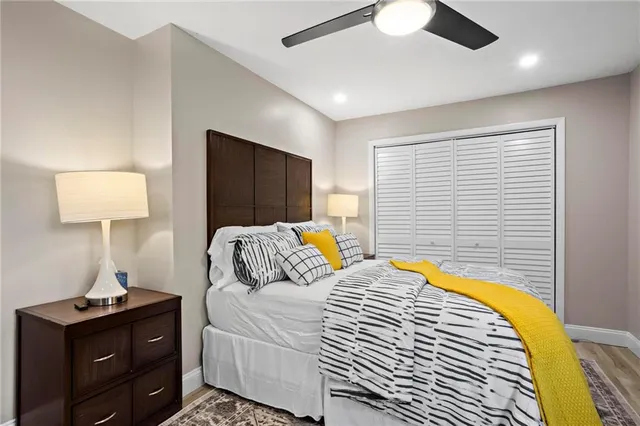 a bedroom with a bed and a lamp