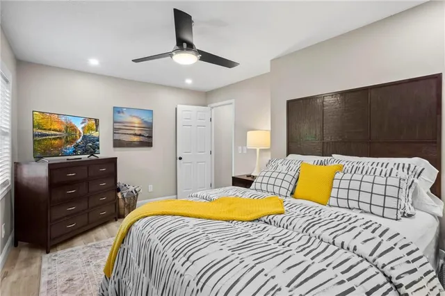 a bedroom with a bed and a dresser