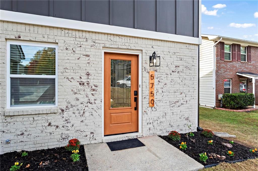 5750 Old Gordon Road Mableton, GA 30126 - Photo 4 of 31 a front view of a house with a yard