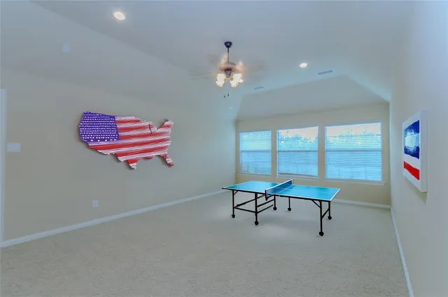 a bedroom with bed and a chandelier