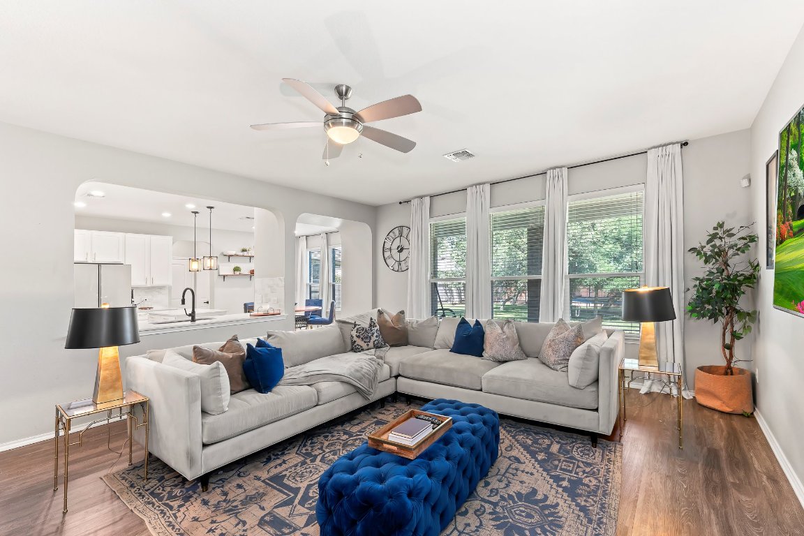 a living room with furniture and a large window