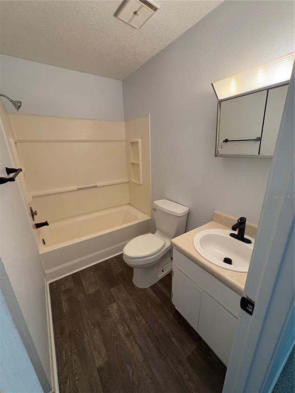 5206 Grimes Road Polk City, FL 33868 - Photo 8 of 17 a bathroom with a sink a toilet and shower