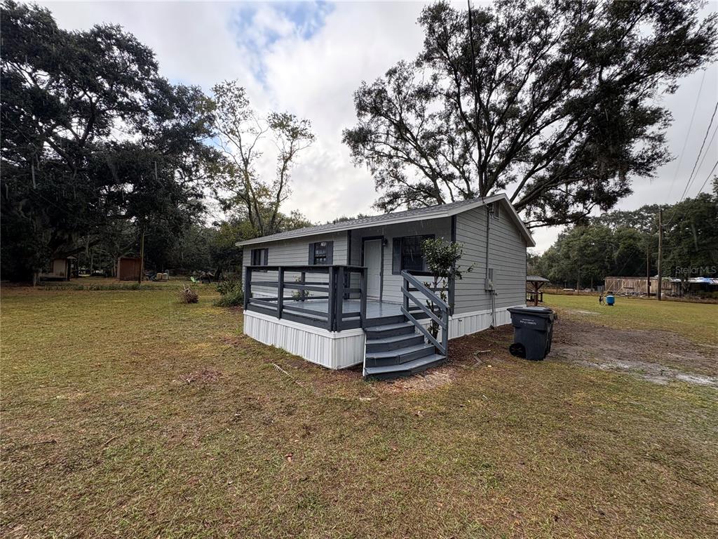 5206 Grimes Road Polk City, FL 33868 - Photo 10 of 17 a view of a house with a yard