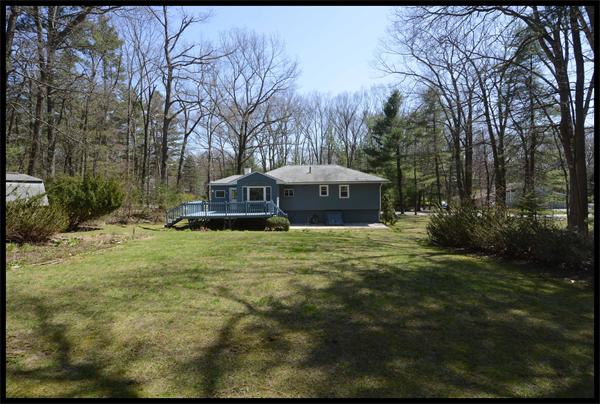 19 Long Meadow Road Chelmsford, MA 01824 - Photo 15 of 19 a front view of a house with a garden