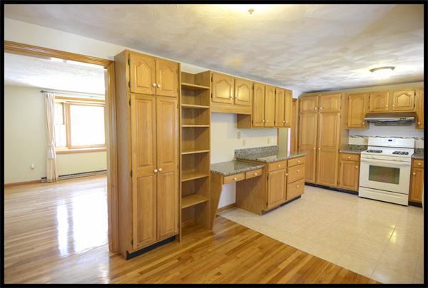 19 Long Meadow Road Chelmsford, MA 01824 - Photo 5 of 19 a kitchen with stainless steel appliances granite countertop a stove a sink and a refrigerator