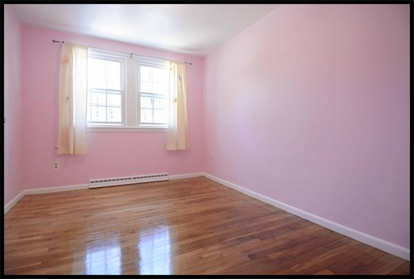 19 Long Meadow Road Chelmsford, MA 01824 - Photo 10 of 19 a view of an empty room with wooden floor and a window
