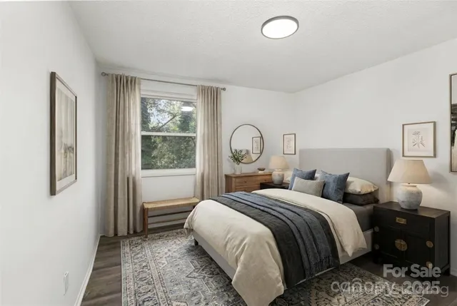 a bedroom with bed and a window