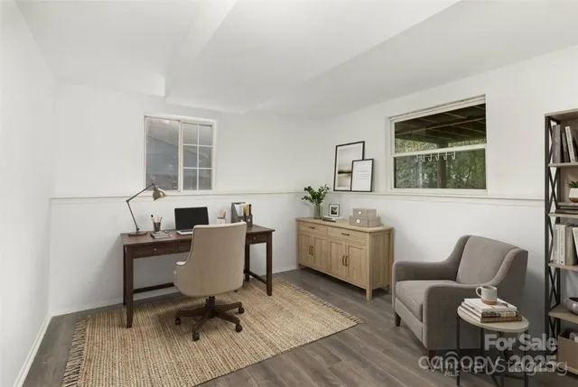 a work room with furniture and windows