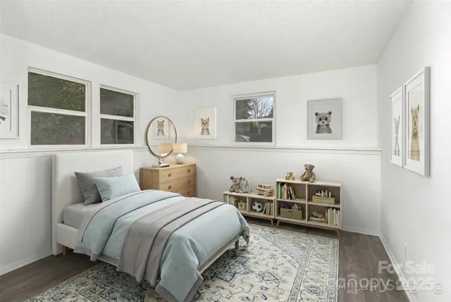 a bedroom with a bed and a desk