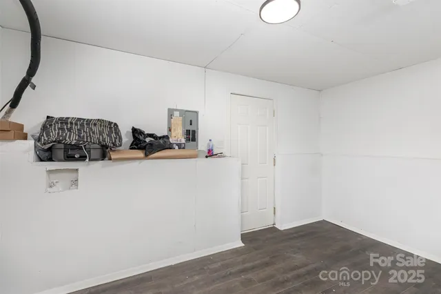 a view of a storage & utility room with two washing machine