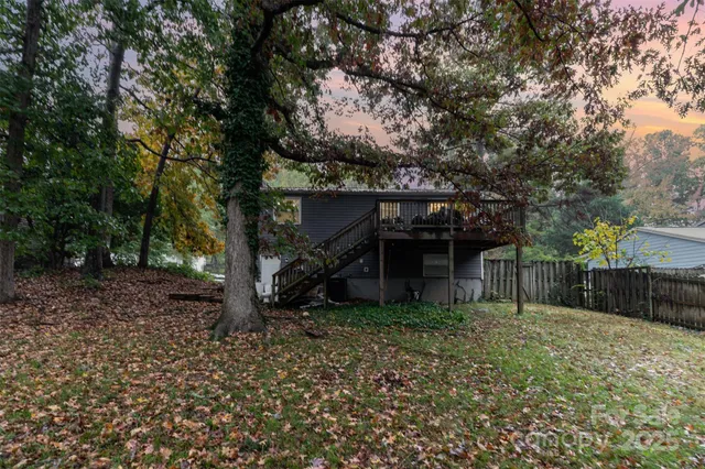 front view of a house with a tree