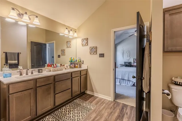 a bathroom with a sink a mirror and a shower