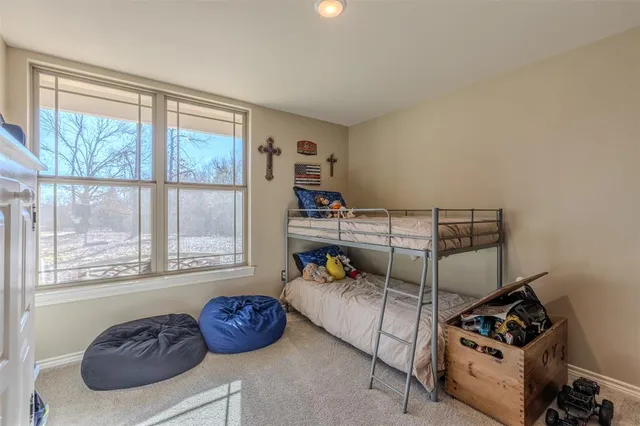 a bedroom with furniture and a window