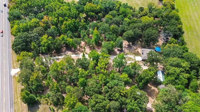 a backyard of a house with lots of green space