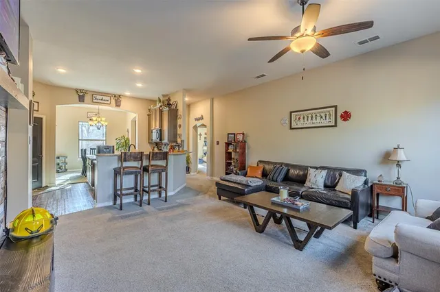 a living room with furniture and a table