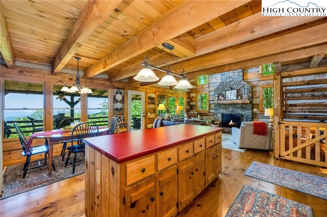 289 Summit Drive Todd, NC 28684 - Photo 13 of 42 a room with table chairs and a barbeque