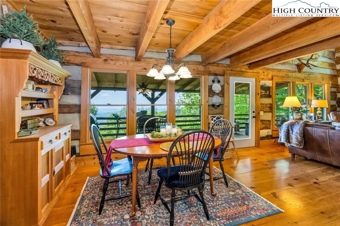 289 Summit Drive Todd, NC 28684 - Photo 15 of 42 a patio with yard glass top table and chairs