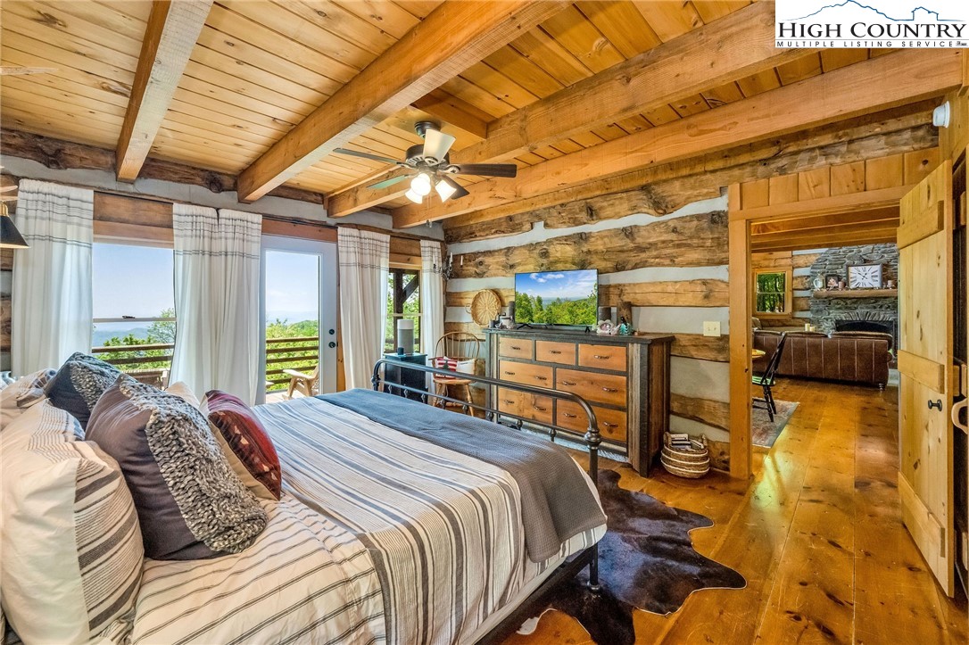 289 Summit Drive Todd, NC 28684 - Photo 19 of 42 a bed sitting in a bedroom next to a window