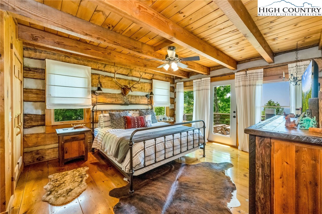 289 Summit Drive Todd, NC 28684 - Photo 20 of 42 a bed room with a bed and a table