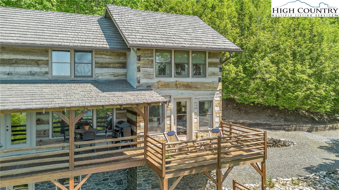 289 Summit Drive Todd, NC 28684 - Photo 24 of 42 a view of a house with a yard and sitting area