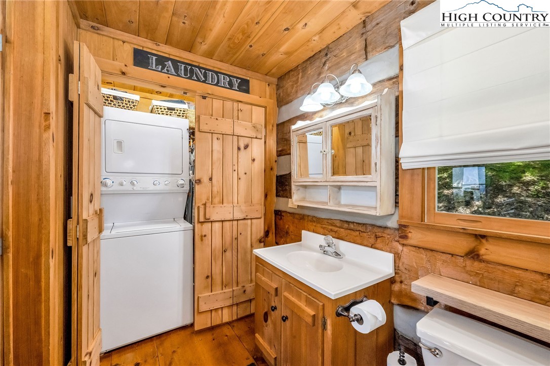 289 Summit Drive Todd, NC 28684 - Photo 26 of 42 a kitchen with a refrigerator and a stove top oven